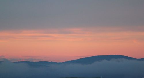 Scenic view of mountains against sky during sunset