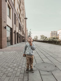 Portrait of man standing on street