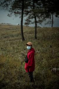 Full length of woman walking on field