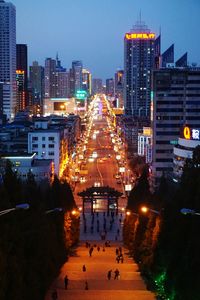 High angle view of illuminated city buildings at night