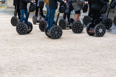 Low section of people standing on motorcycle