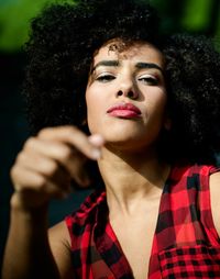 Close-up portrait of woman with afro hairstyle