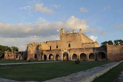 Historic building against cloudy sky