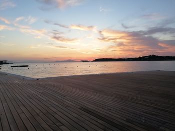 Scenic view of beach against sky during sunset