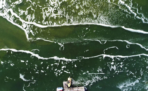 High angle view of people by sea during winter