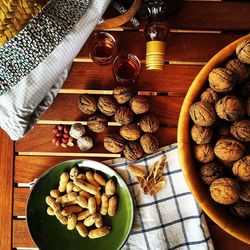 High angle view of nuts and drinks on table