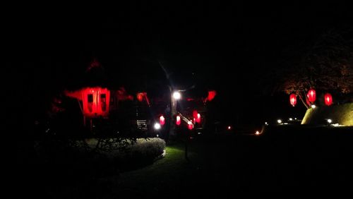 Illuminated red lights at night
