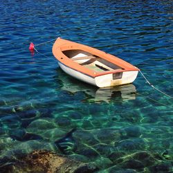 High angle view of boat floating on water