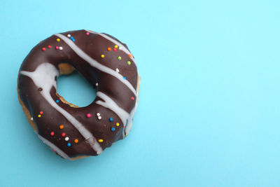 Copy space chocolate  donuts on a blue background.