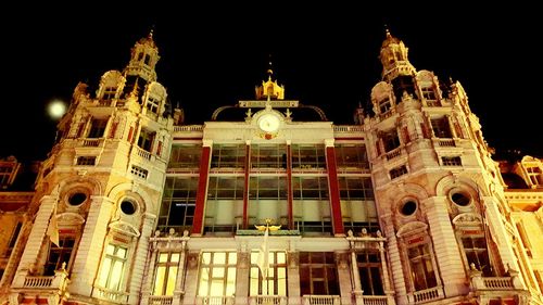 Low angle view of illuminated building at night