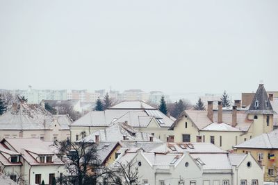 Houses in city against clear sky