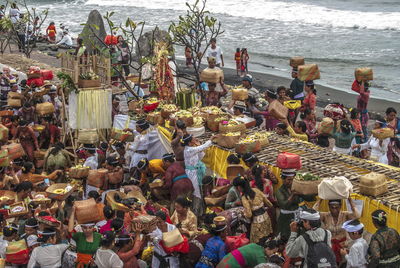 High angle view of people on street by sea