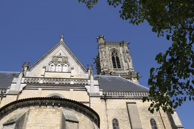 Low angle view of building against clear blue sky