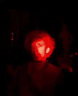 Portrait of man in darkroom