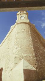 Low angle view of building against blue sky