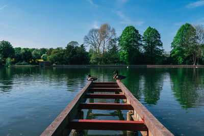 Pier over lake against sky