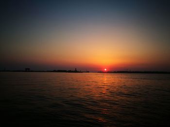 Scenic view of sea against clear sky during sunset
