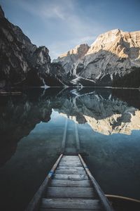 Scenic view of a lake reflecting mountains and sky