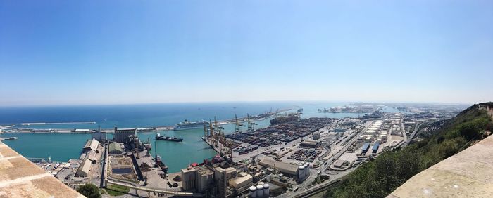 High angle view of buildings against blue sky