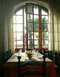 Chairs and table in glass window