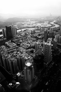 High angle view of modern buildings in city against sky