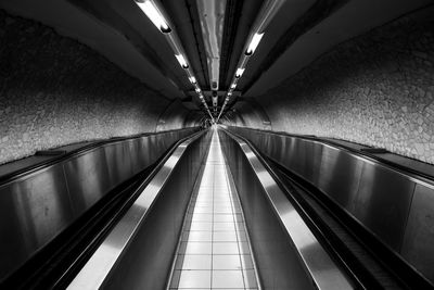 Low angle view of illuminated subway station