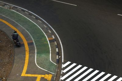 High angle view of zebra crossing on road in city