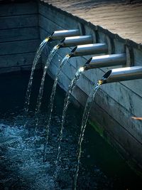 Close-up of water drop from pipe