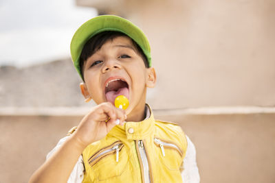 Portrait of boy eating food