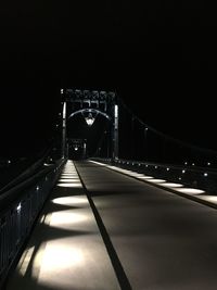 Illuminated bridge at night