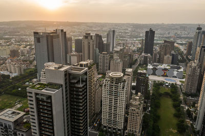 High angle view of modern buildings in city against sky