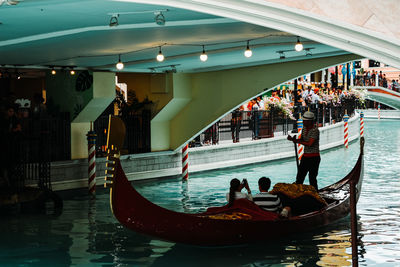 People in boat at canal