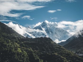 Scenic view of snowcapped mountains against sky