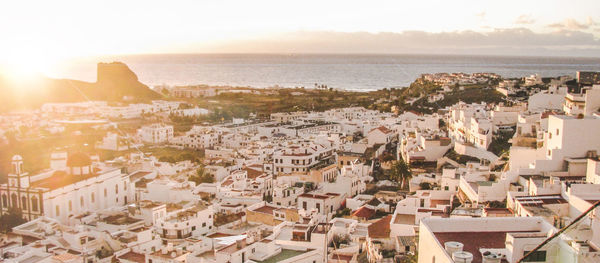 High angle shot of townscape against calm sea