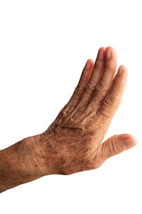 Close-up of human hand against white background