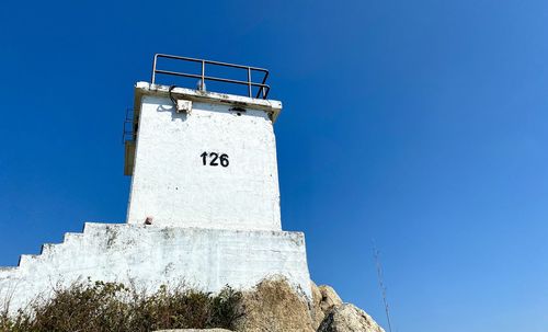 Low angle view of lighthouse against clear sky