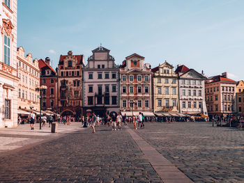 People walking on street in city