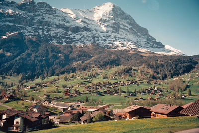 High angle view of townscape and mountains against sky