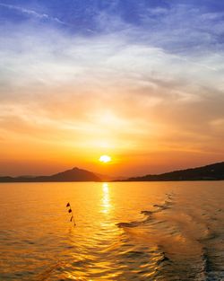 Scenic view of sea against sky during sunset
