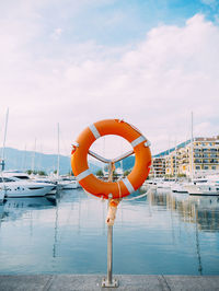 View of sailboat in harbor against sky