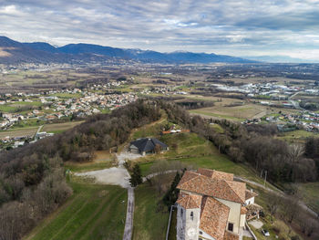 High angle view of houses on field against sky