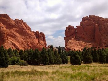 Rock formations on landscape against sky