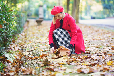 Portrait of woman sitting on field