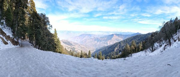 Scenic view of mountains against sky during winter