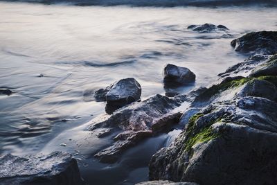 High angle view of rocky shore and waves