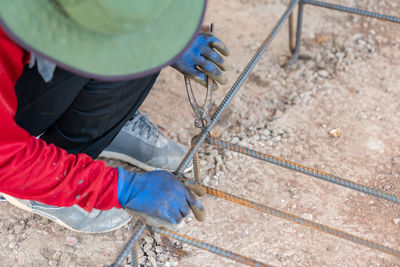 Low section of man welding metal