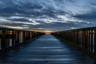 Pier against sky during sunset