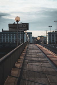 Street amidst buildings against sky