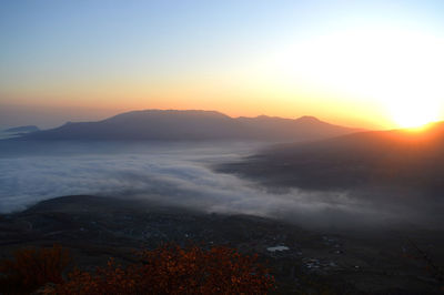 Scenic view of sea against clear sky during sunset