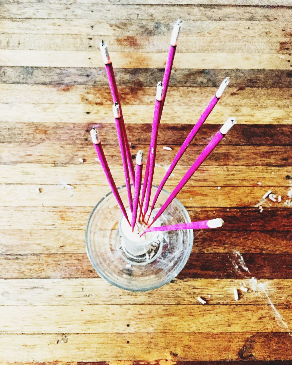 table, still life, indoors, wood - material, high angle view, wooden, close-up, spoon, directly above, flower, single object, no people, freshness, wood, variation, multi colored, two objects, pink color, art and craft, simplicity